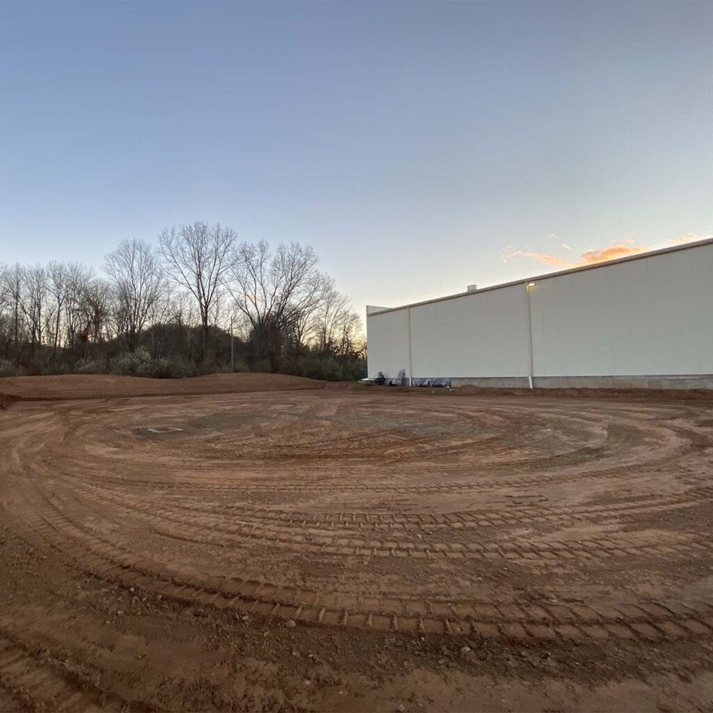 Professional land clearing service removing trees and brush from construction site