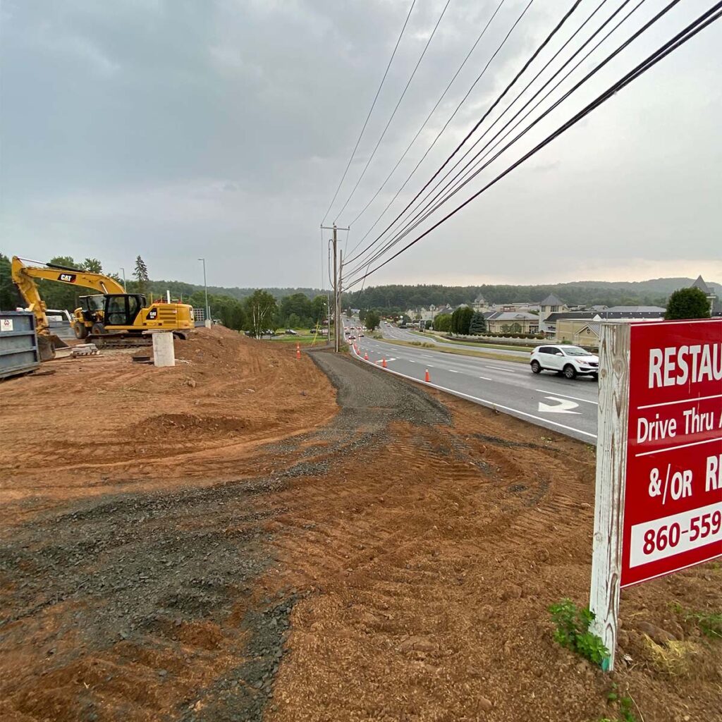 Professional excavating contractor operating heavy machinery in Pompano Beach, FL