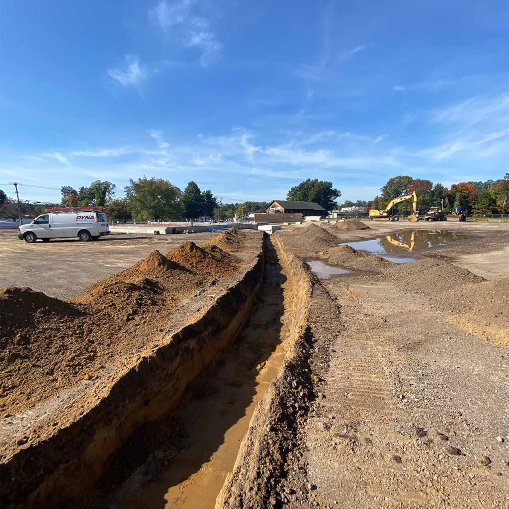 excavating contractor performing residential site preparation with heavy equipment