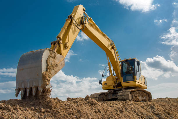 Heavy machinery grading land for commercial site Sadow Excavation