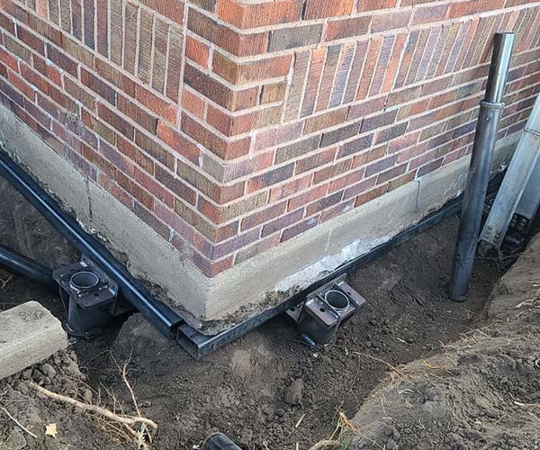 Foundation repair contractor stabilizing residential home foundation in Wellington, Florida